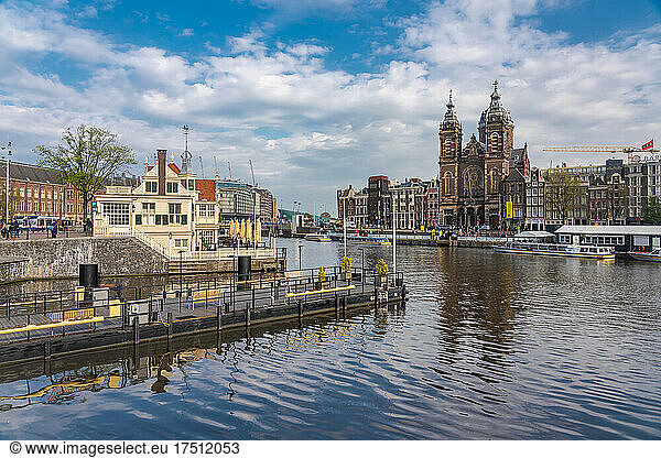 Netherlands  North Holland  Amsterdam  City canal with Basilica of Saint Nicholas in background