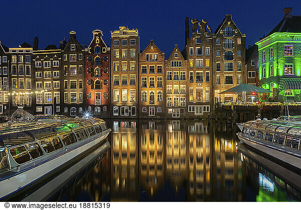 Netherlands  North Holland  Amsterdam  Row of townhouses along canal at night