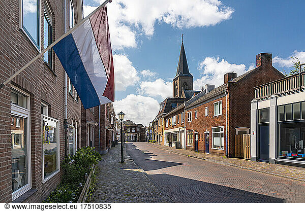 Netherlands  South Holland  Noordwijk  Dutch flag fluttering over empty town street