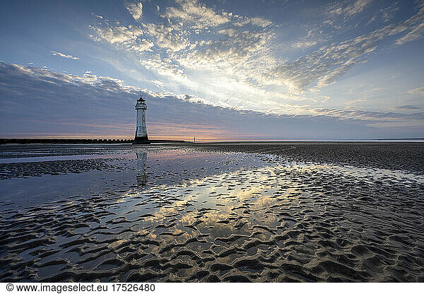 New Brighton Lighthouse reflected in sand at sunset  New Brighton  Cheshire  England  United Kingdom  Europe