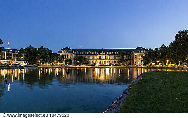 New Palace in front of Eckensee lake under sky at night  Stuttgart  Germany