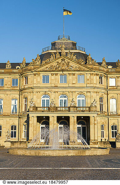 New Palace with fountain under blue sky  Stuttgart  Germany