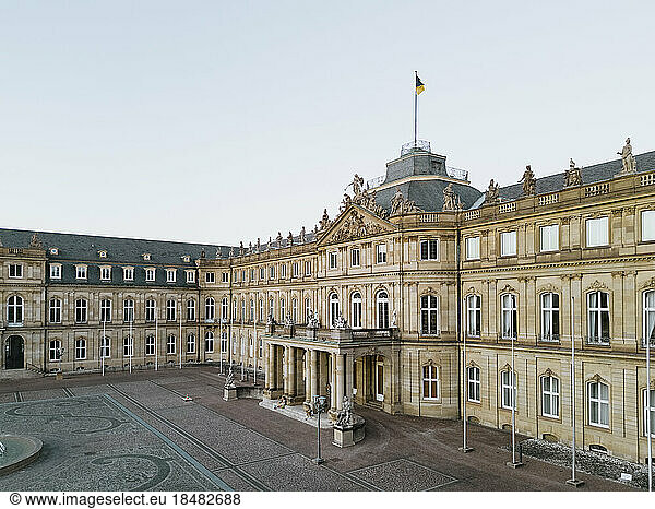 New Palace with German flag at sunset  Stuttgart  Germany