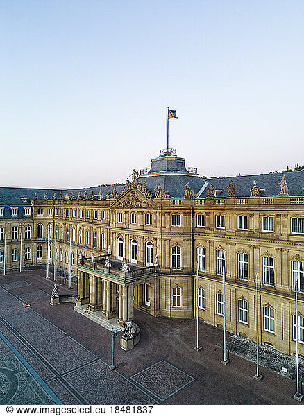 New Palace with German flag under sky at sunset  Stuttgart  Germany