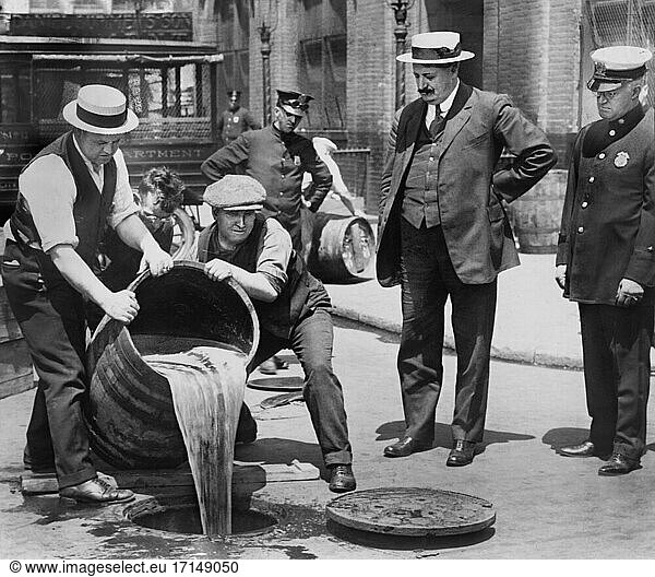 New York City Deputy Police Commissioner John A. Leach  right  watching Agents pour Liquor into Sewer following Raid during height of Prohibition  New York City  New York  USA  New York World-Telegram and the Sun Newspaper Photograph Collection  1921