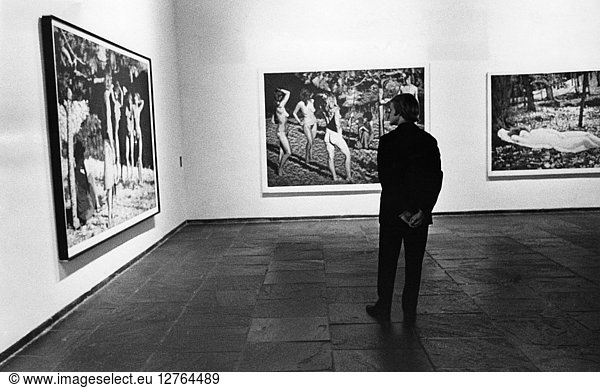 NEW YORK: WHITNEY MUSEUM. A man viewing artwork in the '22 Realists' exhibition at the Whitney Museum in New York City. Photograph  1970.