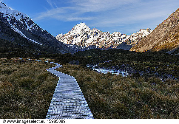 New Zealand  Canterbury  Boardwalk in Hooker Valley at dusk with Mount Cook in background