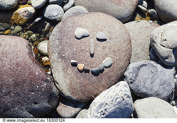 New Zealand  Marlborough Sounds  Pelorus river  smiley made of stones