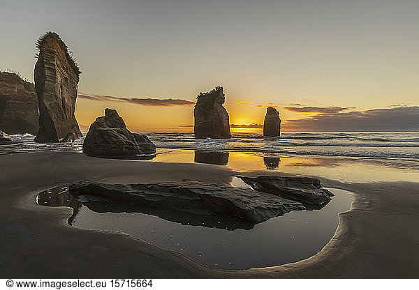 New Zealand  New Plymouth District  Tongaporutu  Three Sisters rock formation at sunset