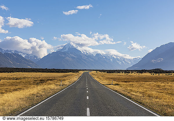 New Zealand  Oceania  South Island  Canterbury  Ben Ohau  Southern Alps (New Zealand Alps)  Mount Cook National Park  Mount Cook Road and Aoraki / Mount Cook  Empty road in mountain landscape
