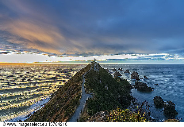 New Zealand  Oceania  South Island  Southland  Otago  Southern Scenic Road  Cape Nugget Point  Nugget Point Lighthouse at sunrise
