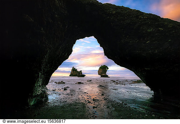 New Zealand  South Island  MotukiekieÂ Beach sea stacks seen through natural arch