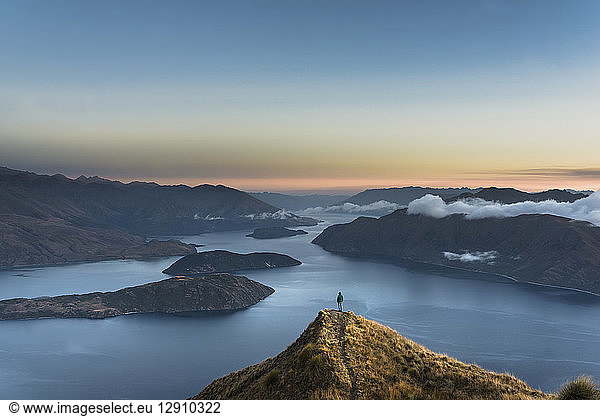 New Zealand South Island Wanaka Otago Woman on Coromandel peak at sunrise