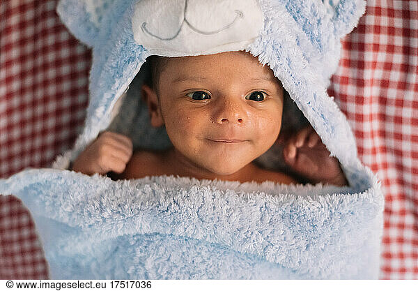 Newborn baby wrapped in a towel.