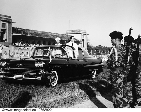 NGO DINH DIEM (1901-1963). Vietnamese political leader. As President of South Vietnam reviewing paratrooper units from the rear of an open car with Army Chief of Staff General Le Van Ty during ceremonies marking the sixth anniversary of the founding of the army's Airborne Group at Phu Tho racetrack in Saigon 1 December 1961.