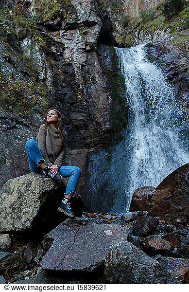 Nice Girl traveler at the mistyc waterfall