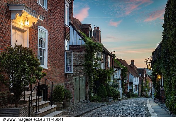 Night falls on the iconic Mermaid Street in Rye  East Sussex  England.