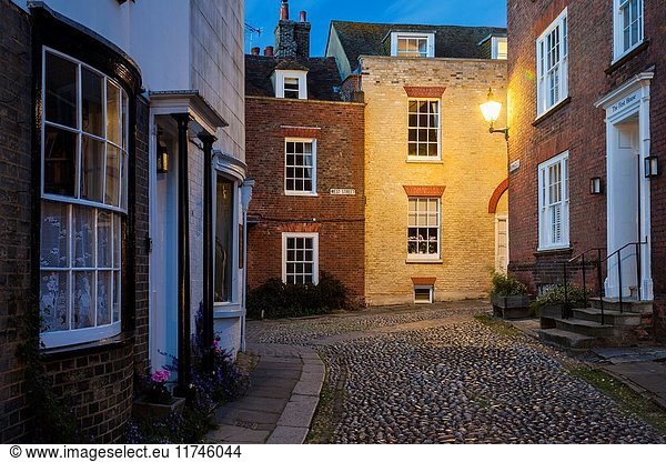 Night falls on the iconic Mermaid Street in Rye  East Sussex  England.