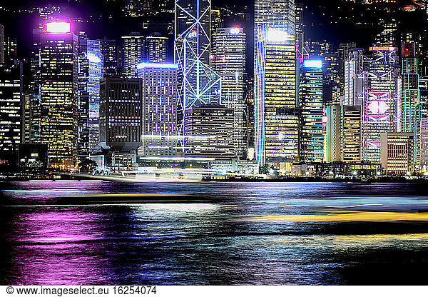 Night view of Hong Kong and moving light trails of boats; Hong Kong  Hong Kong Special Administrative Region (SAR)  Hong Kong