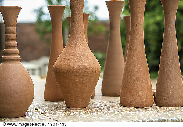 Nine clay pottery vases on display at the Santander El Alfarero Casa Chichi workshop inTrinidad  Cuba