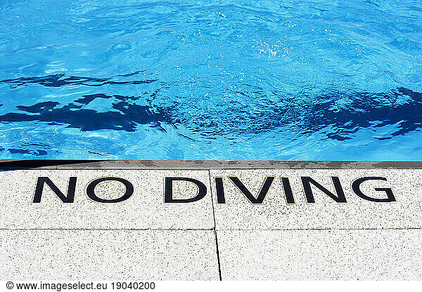 No Diving sign at the waters edge  The Floating Pool at Brooklyn Bridge Park Beach  NY.