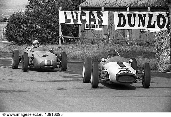 No 44 Ian Burgess in the Lotus-Climax leading no 8 Jo Bonnier in Porsche 718 at Melling Crossing. British Grand Prix  Aintree. England 15 July 1961.
