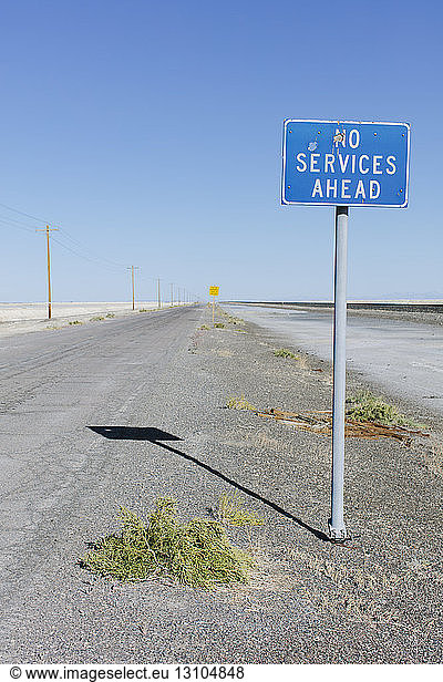 No Services Ahead sign along remote desert road