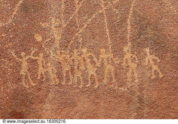 North Africa  Sahara  Algeria  Tassili N'Ajjer National Park  Tadrart  neolithic rock art  engraving of a group of people playing with a ball