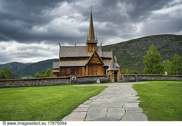 Norway  Innlandet  Lom  Footpath in front of historic stave church