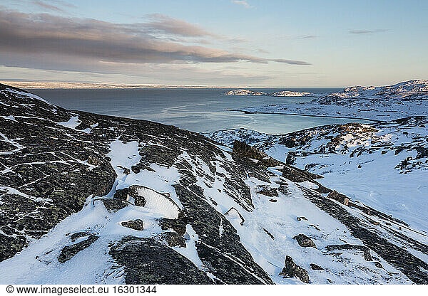 Norway  Karlebotn  Varangerfjord  Snow covered rock surface