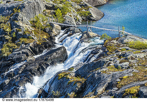 Norway  Nordland  Bridge over Litlverivassfossen waterfall in Rago National Park