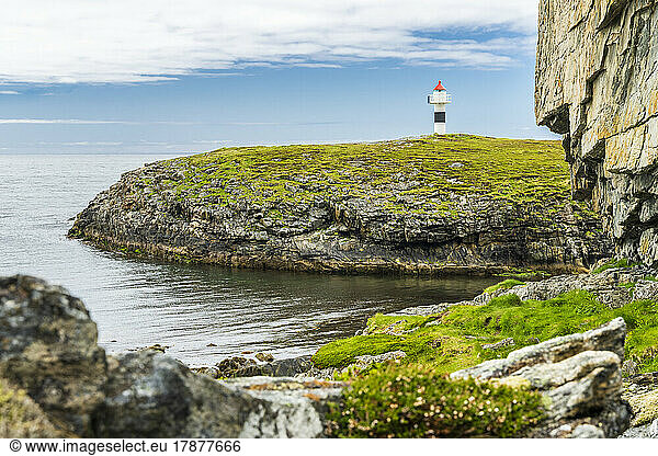 Norway  Nordland  Coastline of Andoya island with lighthouse in background
