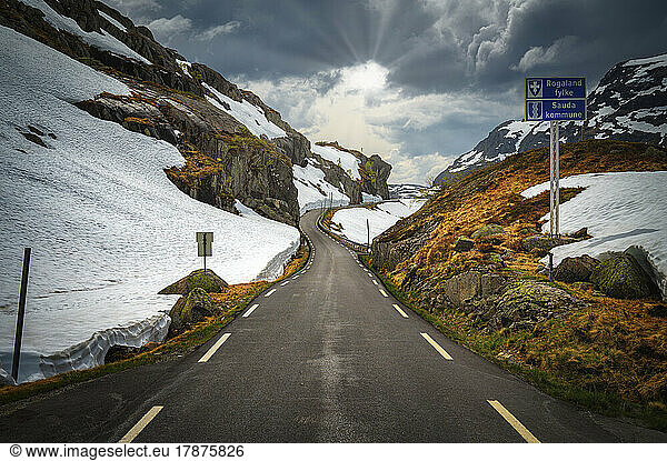 Norway  Rogaland  Sauda  Road 520 stretching between snow-covered hills