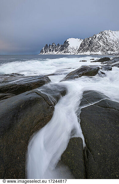 Norway  Tromso  Ersfjord  Sea waves at rocky coast of Senja Island in winter