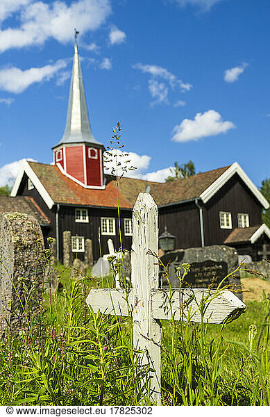 Norway  Viken  Flesberg  Medieval stave church in summer with graves in foreground
