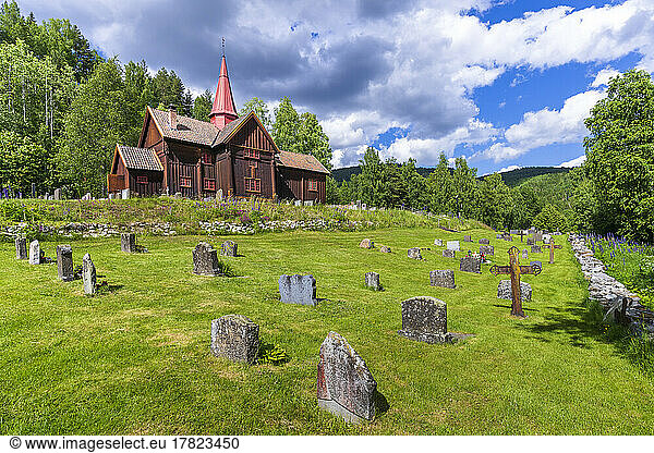 Norway  Viken  Rollag  Cemetery in front of medieval stave church in summer