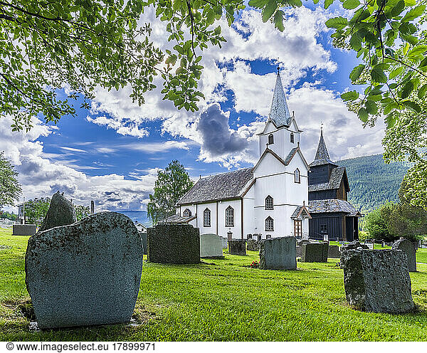 Norway  Viken  Torpo  Cemetery tombstones with rural church in background