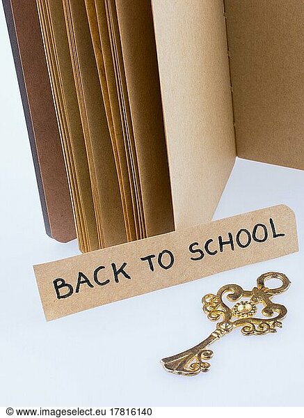 Notebook  key and and back to school title on a notebook