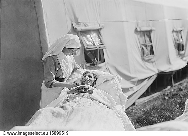 Nurse cheering up Injured American Soldier  American Military Hospital No. 5  supported by American Red Cross  Auteuil  France  Lewis Wickes Hine  American National Red Cross Photograph Collection  September 1918