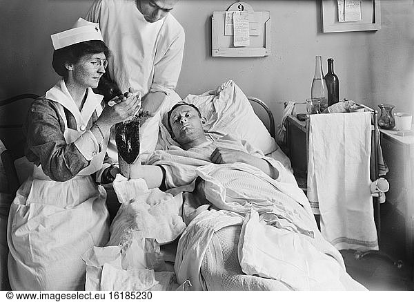 Nurse Dressing Wound of Injured American Soldier at Military Hospital I  Neuilly  France  Lewis Wickes Hine  American National Red Cross Photograph Collection  June 1918