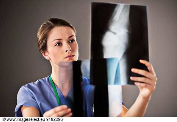 Nurse examining x-rays