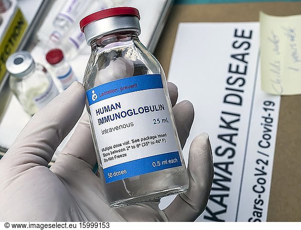 Nurse hold human immunoglobulin vial generic drug to treat Sars-CoV-2-related Kawasaki disease in children under five  conceptual image  unbranded generic drug containers and hypothetical bar codes.