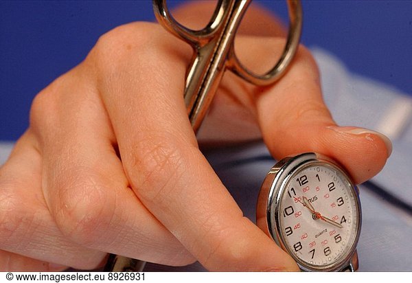 Nurse holding a fob watch and a pair of scissors.