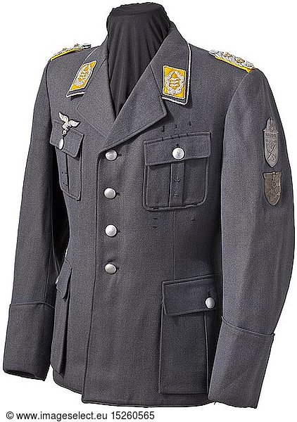 Oberst Gordon Gollob - a personal uniform coat of Luftwaffe blue gabardine with stitched-in shoulder boards  silver embroidered collar patches and breast eagle with numerous orders loops and the Narvik and Krim shield sewn directly onto the sleeve without cloth underlay. The bluish silk liner with tailor's tag of 'Holters Berlin'  wearer name label missing. An obviously used  well-travelled coat with small flaws. historic  historical  Air Force  branch of service  branches of service  armed service  armed services  military  militaria  air forces  object  objects  stills  clipping  clippings  cut out  cut-out  cut-outs  20th century