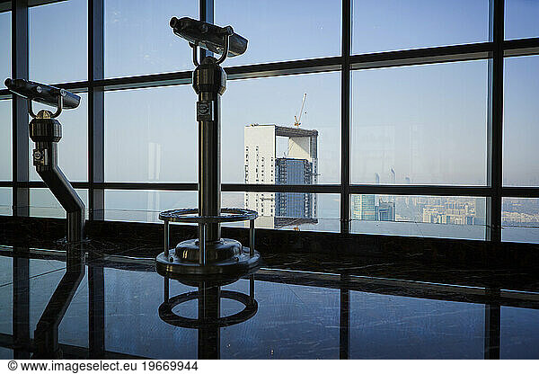 Observation deck with binoculars in skyscraper  Abu Dhabi  United Arab Emirates