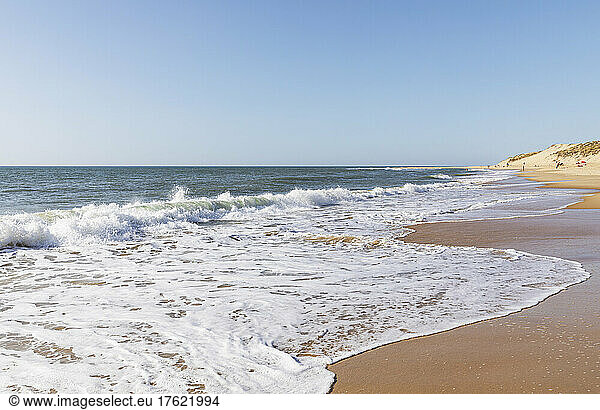 Ocean waves brushing sands of Plage du Vieux Phare beach