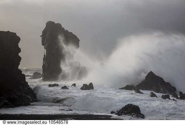 Ocean waves crashing against rock formations  Londrangar  Snaefellsnes  Iceland