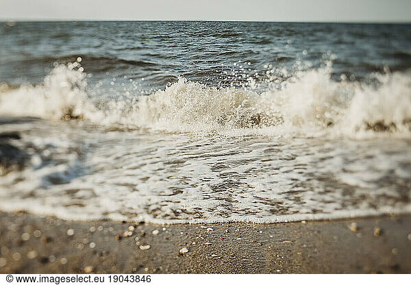 Ocean waves on a sunny day at beach shore in Cape Cod  Massachusetts
