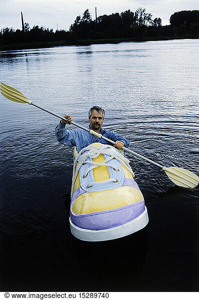 oddities  leisure time  Hobbies  sports  boat in shoe form  Georg Wessels  Vreden  driving with his shoe boat on lake  October 1990
