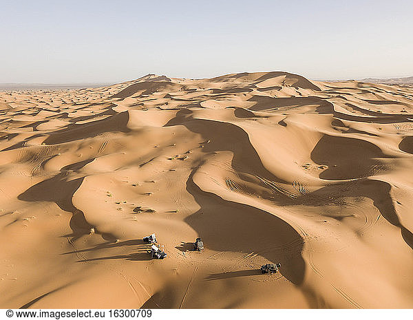 Off-road cars in vast barren desert